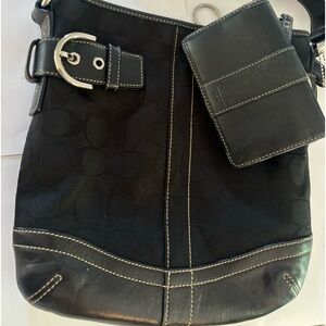 Black Coach bag with small wallet.